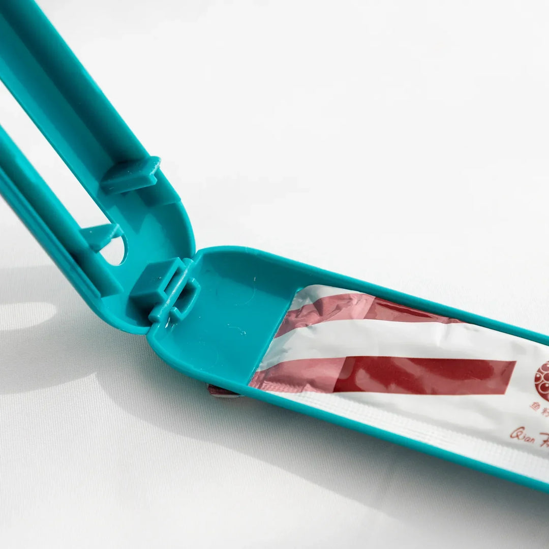 Compact pet food dispenser spoon, designed with a slider for clean, controlled feeding of wet cat & dog food.