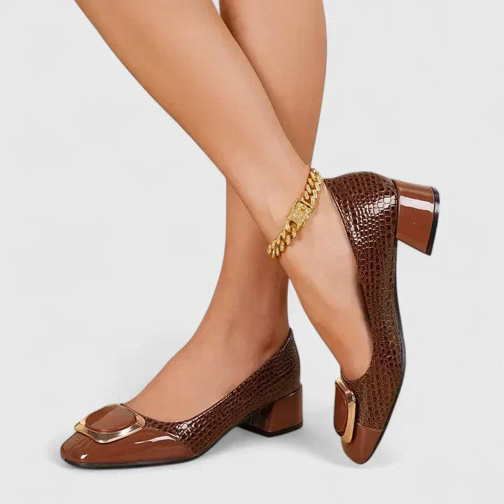Elegant women's dress loafers with a stylish block heel and sleek closed-toe silhouette.