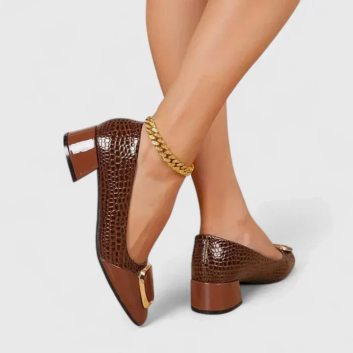 Women's stylish block heel loafers with an elegant closed-toe design.