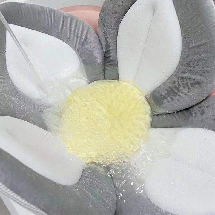 Adorable blooming flower infant bath seat. Soft plush support for a safe & cozy newborn bathing experience.