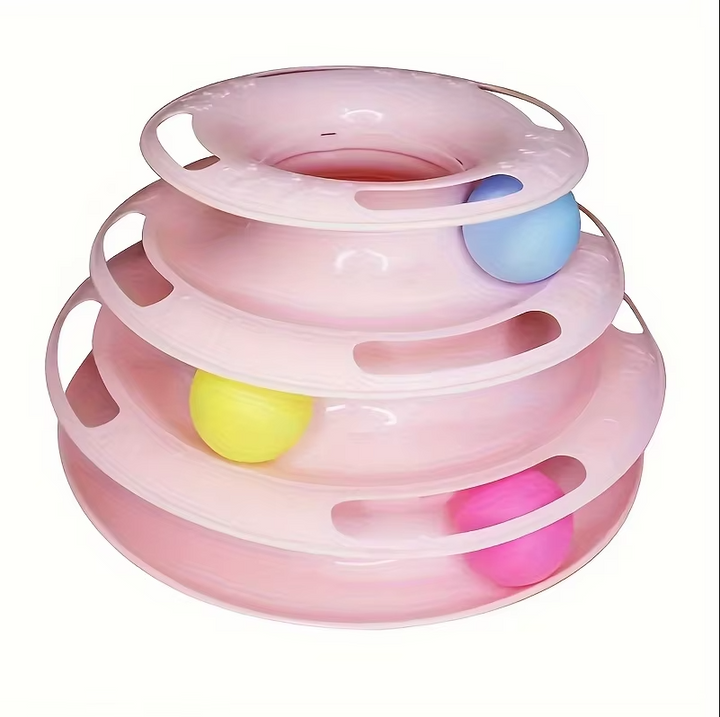 Close-up of a cat pawing at spinning balls on an interactive 3-tier cat play tower. Durable multi-level kitten toy.