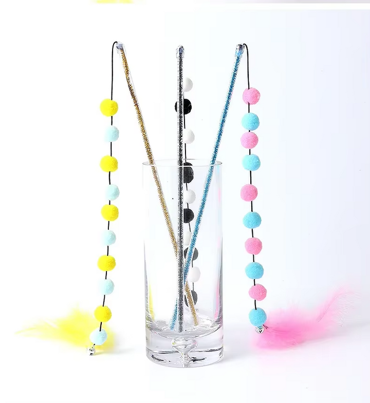 Dynamic interactive cat fishing rod toy with feathers & pom-poms, encouraging playful exercise.