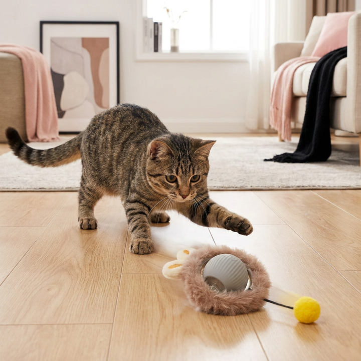 Close-up of the interactive cat play ball with a detailed feathery tail, great for active feline fun.