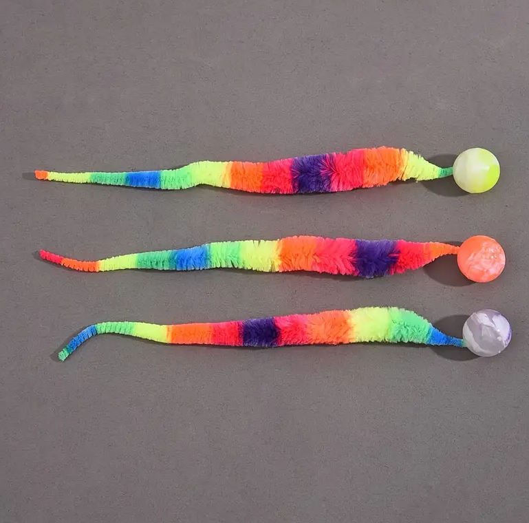 Soft plush interactive cat toy with a wiggle tail & attached ball for engaging feline play.