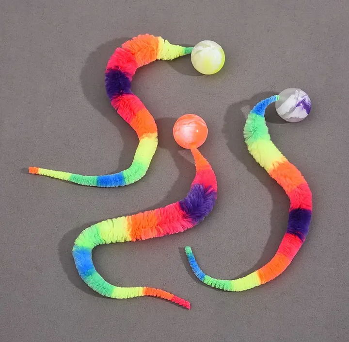 Sensory cat plush toy with moving tail & attached ball encourages natural hunting instincts.