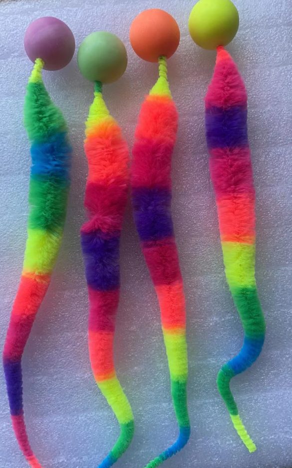 Plush interactive cat toy with a fun wiggle tail & attached ball, perfect for active cats.