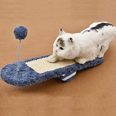 Interactive cat rocker with a corrugated scratching board and dangling toy, perfect for feline enrichment & happy claws.