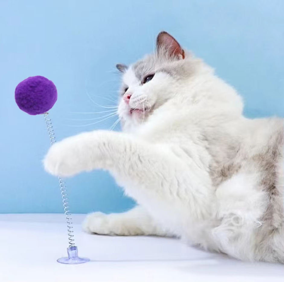 Interactive cat shuttlecock toy with strong suction cup base, perfect for feline play & mental stimulation.