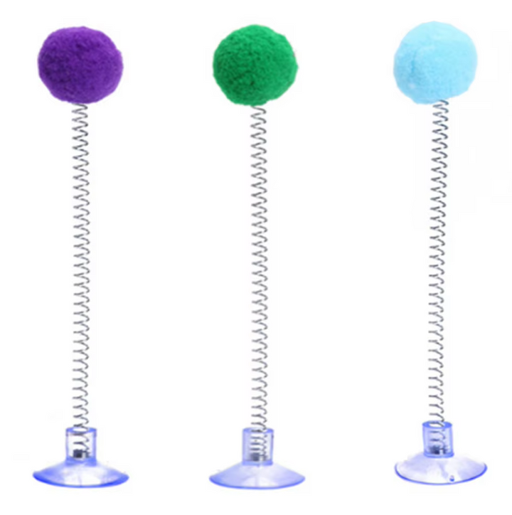 Feline enrichment shuttlecock toy with a spring & pompom, designed with a strong suction cup for play.