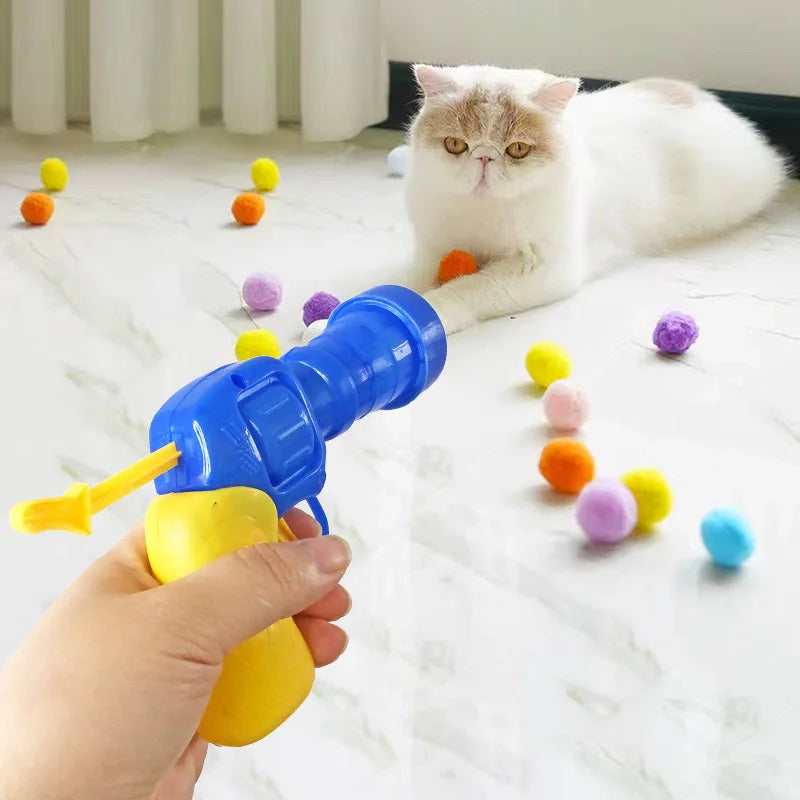 Interactive cat toy cannon launching soft balls for feline fun & hunting instinct play.