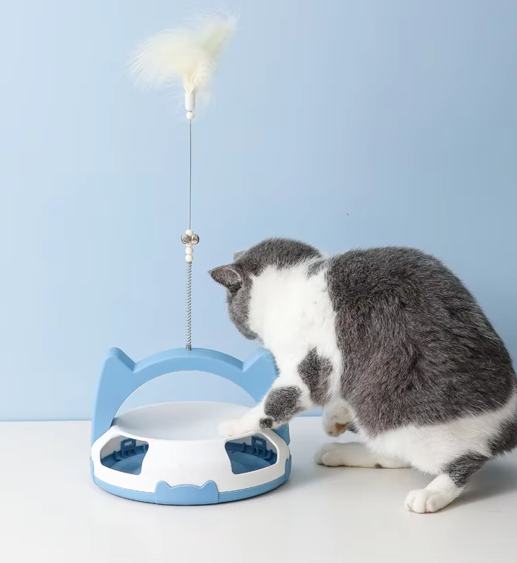 Dynamic interactive cat toy for active pets; includes feather and rolling ball for mental enrichment.