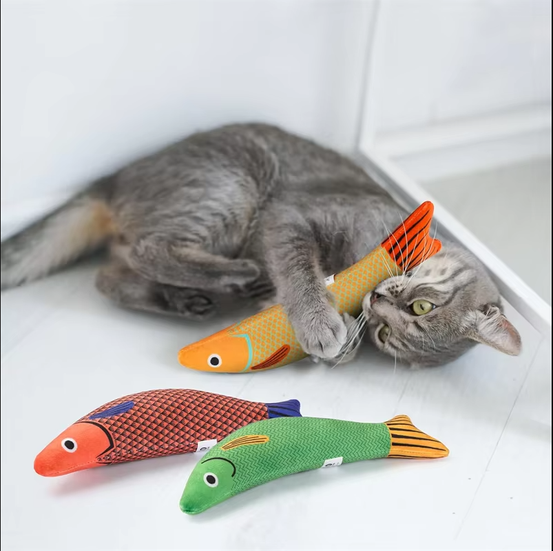 Catnip-filled fish toy for cats, featuring realistic fish sounds and movements to engage pets in active play.