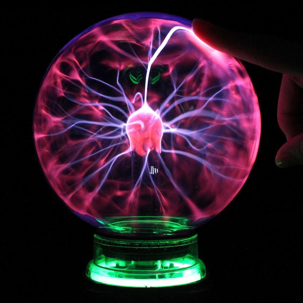 "Interactive plasma globe light with vibrant touch-activated plasma arcs, enhancing home decor with elegant glass design."