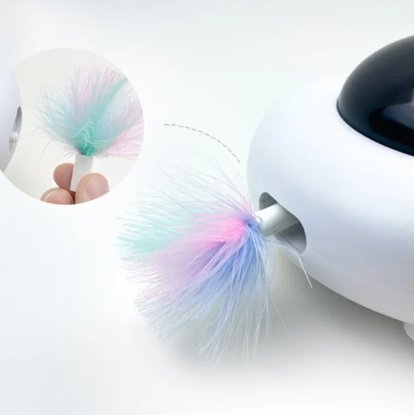 White interactive cat toy featuring LED lights & a feather tail, designed for kitten play & active pet enrichment.