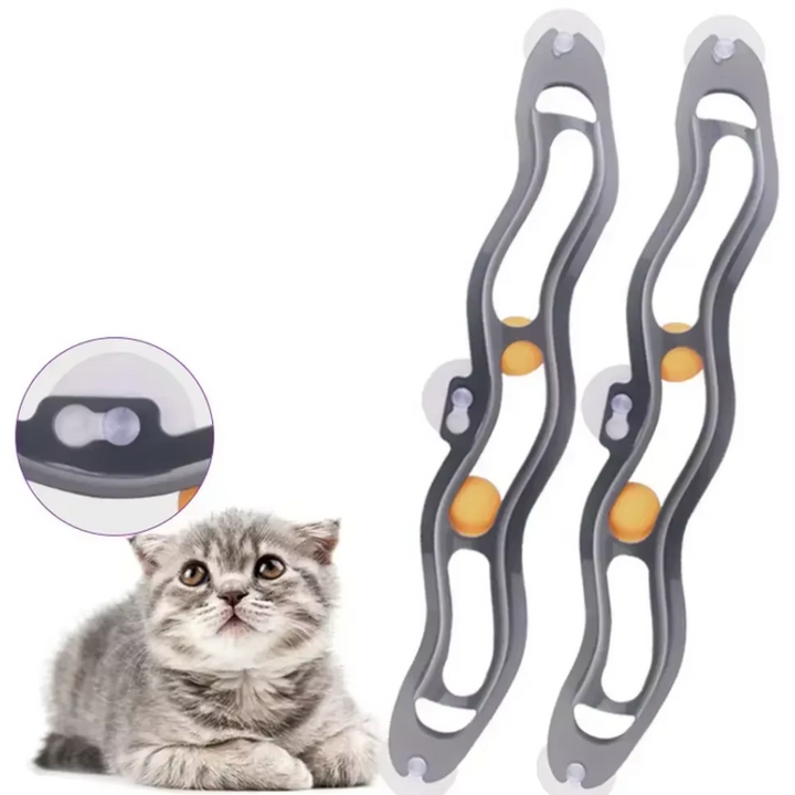 Space-saving window-mounted cat play track with suction cups and movable balls for interactive feline fun.