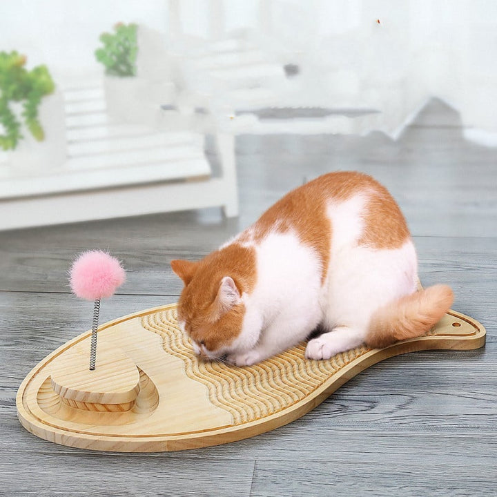 Interactive wooden cat scratching board with feather and ball toy for feline enrichment.