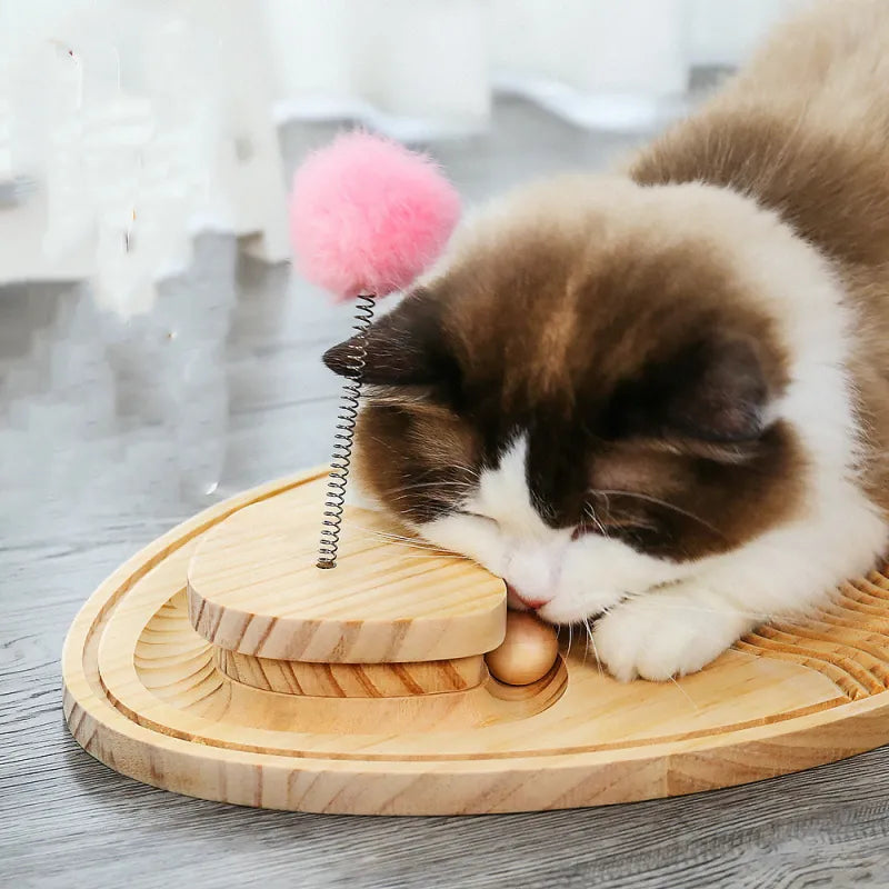 Engaging wooden cat scratcher & play mat with feather & ball for happy, active indoor cats.