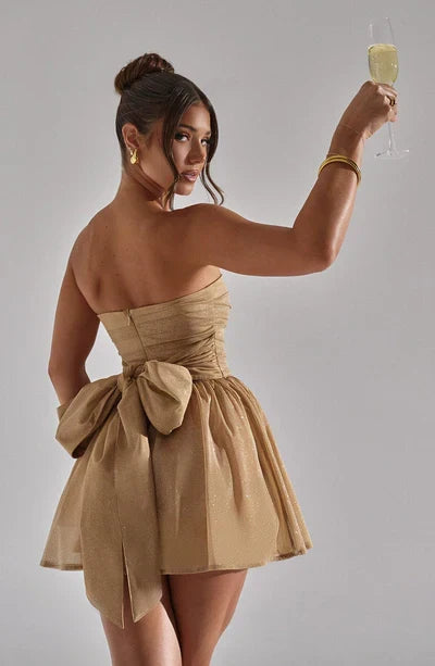 Chic strapless flared mini dress for women. Dazzling glitter fabric, A-line silhouette.