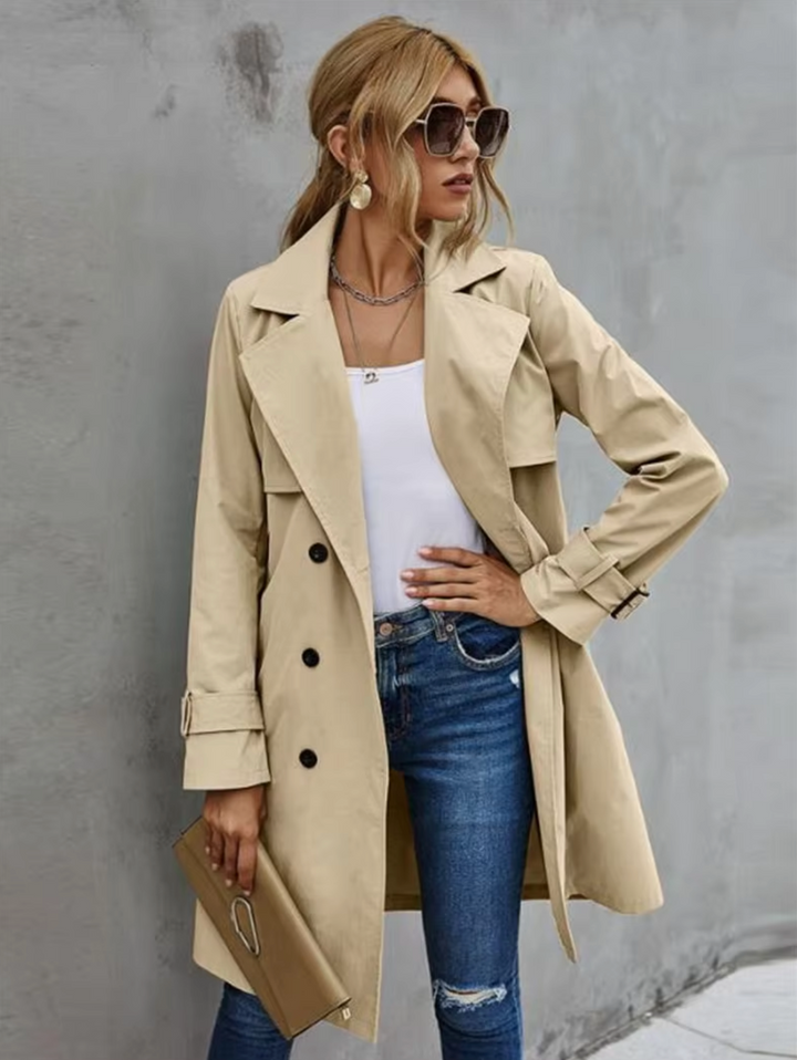 Khaki double-breasted belted trench coat for women, classic fall fashion outerwear.