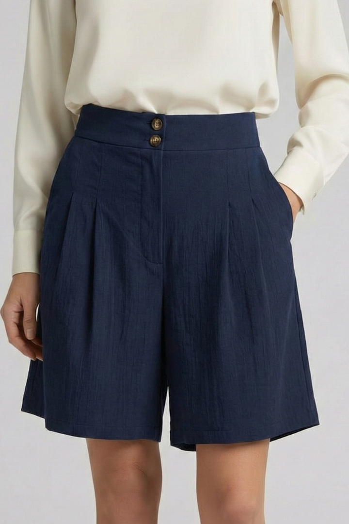 Elegant black high waist tailored shorts, perfect for a polished summer outfit.