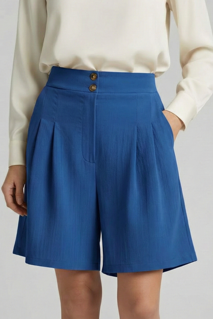 Side view of women's khaki pleated shorts, showing the flattering silhouette.