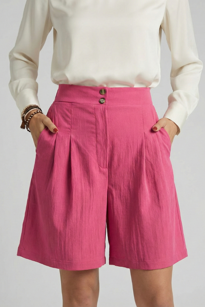 Crisp khaki pleated tailored shorts for women, combining comfort with style.