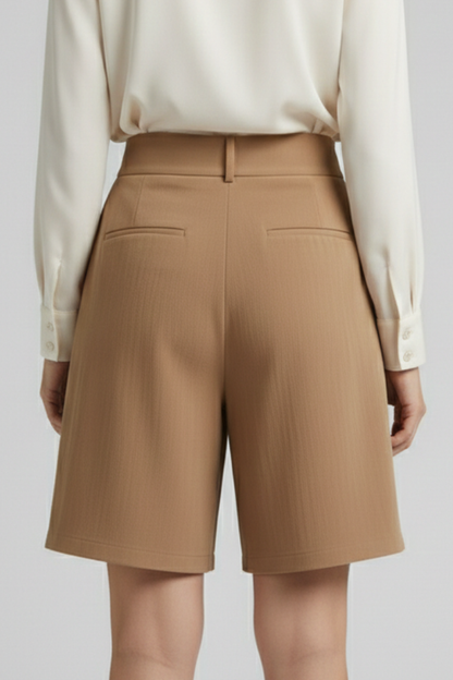 Front view of women's khaki pleated shorts with high waist, emphasizing tailored fit.