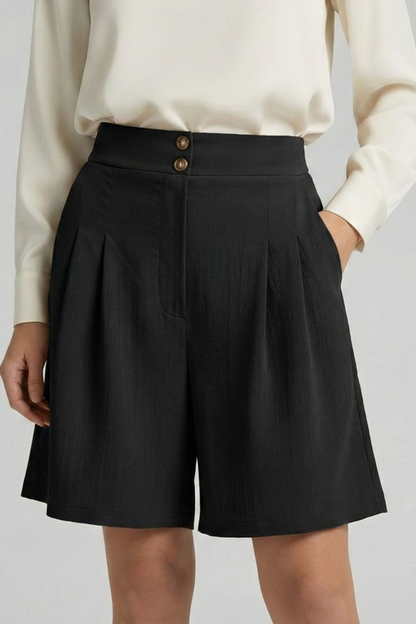 Stylish pleated tailored shorts in khaki, designed for comfort and fashion.