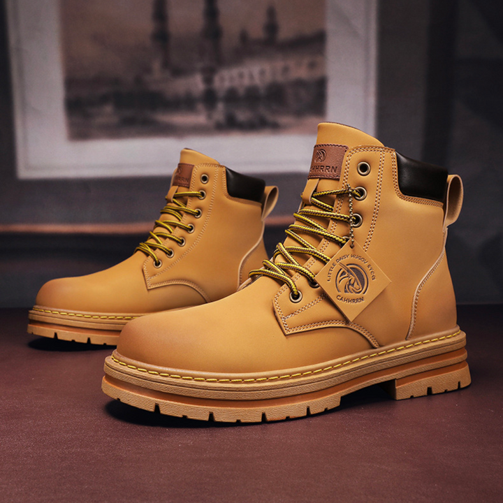 Khaki men's durable laced hiking boots for outdoor trekking and adventure, side view.