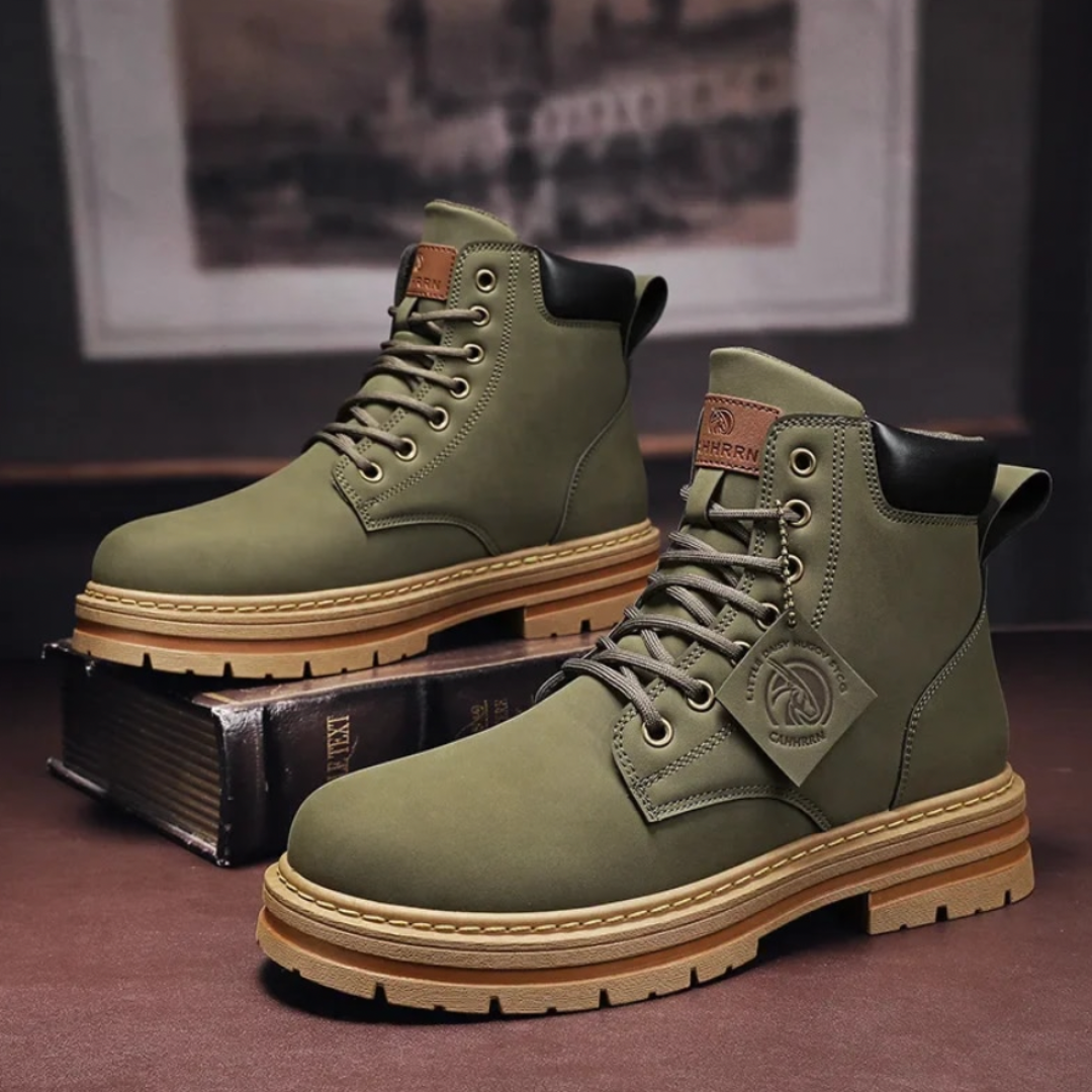 Pair of black men's outdoor shoes, durable laced hiking boots on an adventure trail.