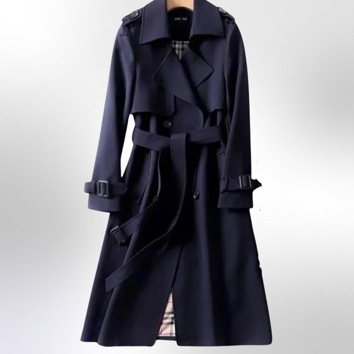 Back view of women's classic navy trench coat with storm flap and belt detail