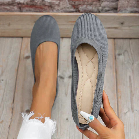 Close-up of a women's comfortable ballet flat shoe in khaki, highlighting soft material.