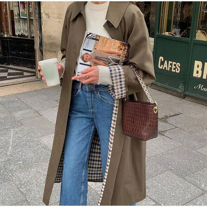 Stylish women's all-season khaki trench coat, relaxed fit and waterproof for outdoor wear