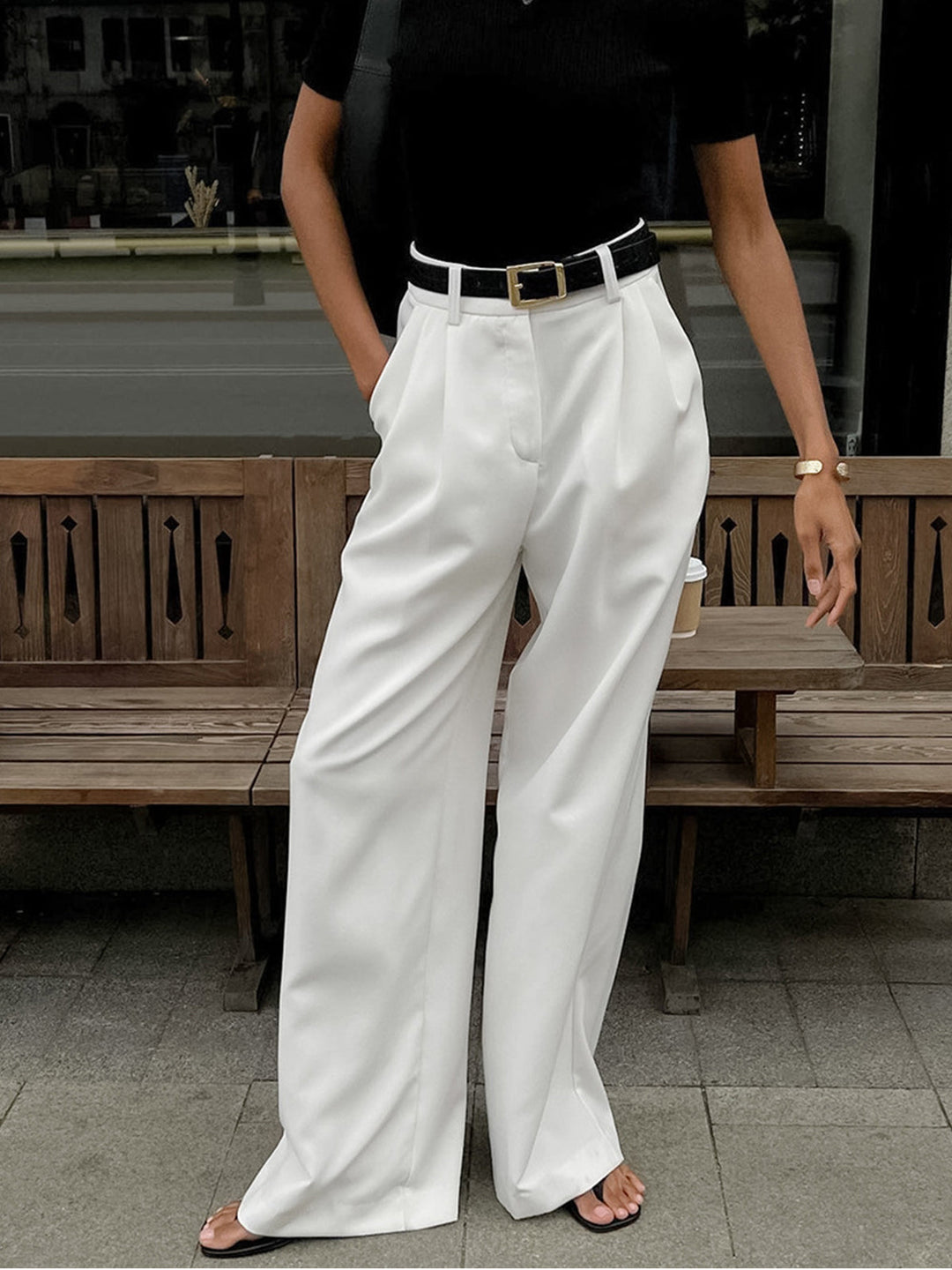 Stylish women's relaxed fit wide leg trousers in a neutral color, ideal for the office
