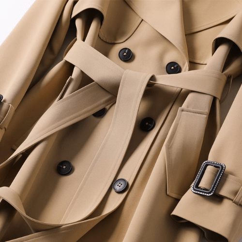 Elegant black women's trench coat, classic vintage style reimagined with modern details, stylish outerwear