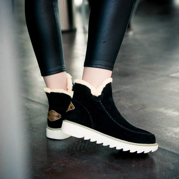 Women's brown insulated snow boots, showcasing a practical and stylish winter look