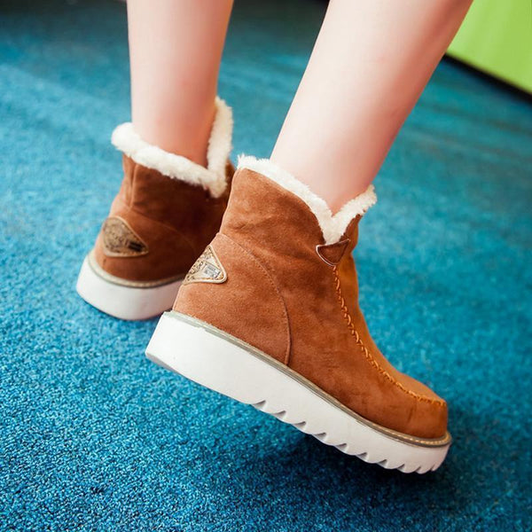 Pair of khaki women's waterproof winter boots, ready for cold and snow