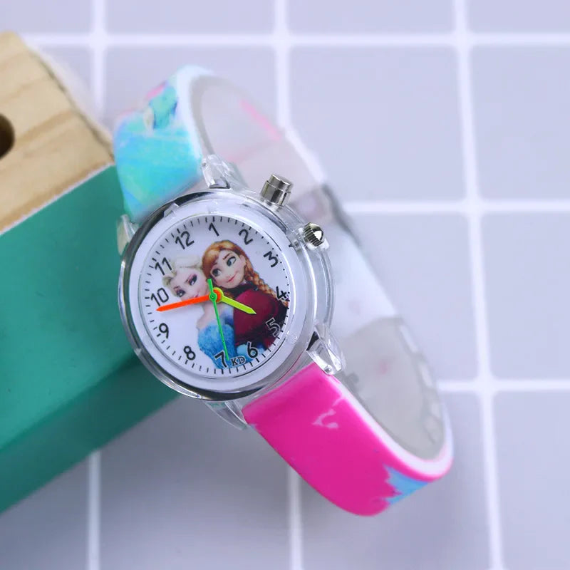 Girls' cartoon watch, Frozen design, glow-in-the-dark dial & soft blue silicone strap.