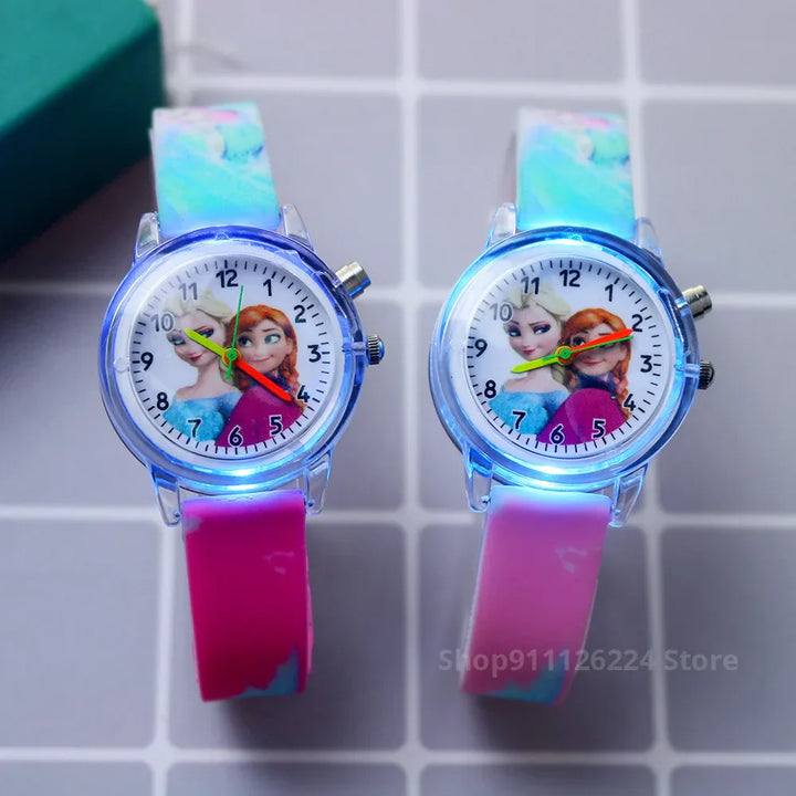 Frozen Elsa & Anna glow watch for girls. Blue silicone strap, easy-to-read time teacher dial.