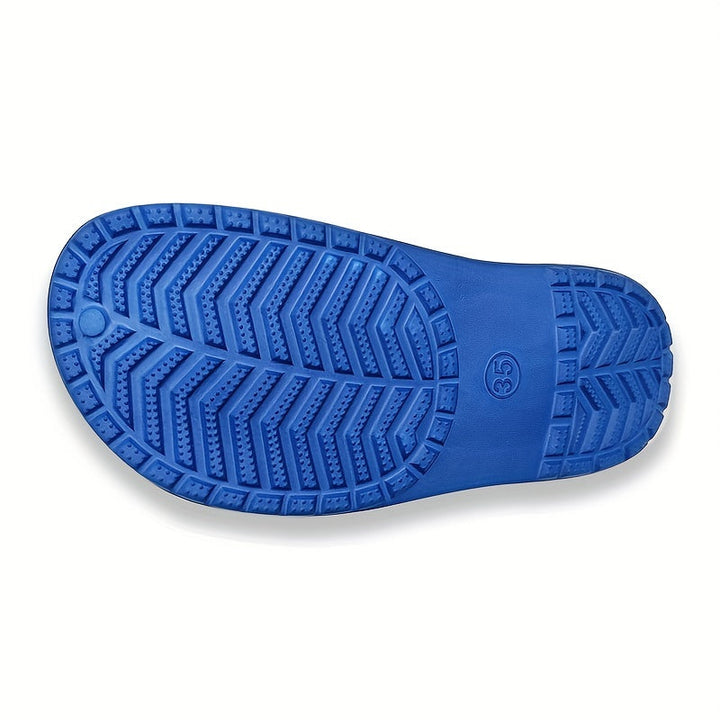 Vibrant glow-in-the-dark clogs, essential anti-slip shoes for kids' playtime. Easy to clean & comfortable.
