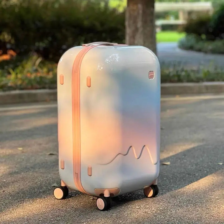 Kids' hard shell travel suitcase with secure combination lock & smooth spinner wheels. Durable & lightweight for journeys.