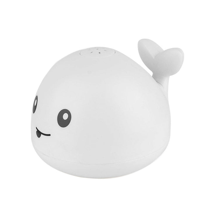 Developmental baby bath toy: a light-up whale sprinkler encourages sensory play and makes bath time exciting for toddlers.