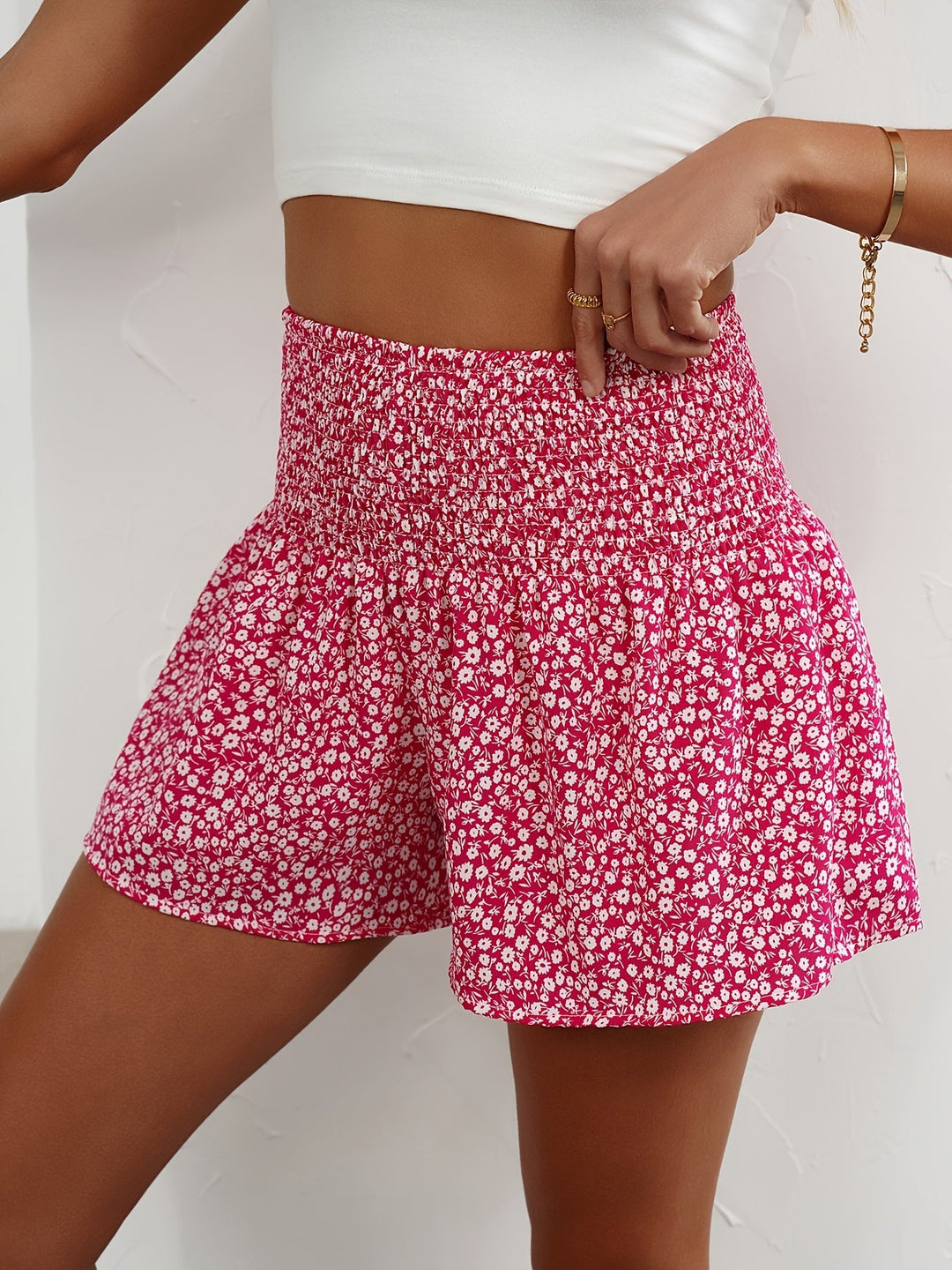 Stylish ladies' floral print shorts with an easy-fit elastic waist for summer comfort.