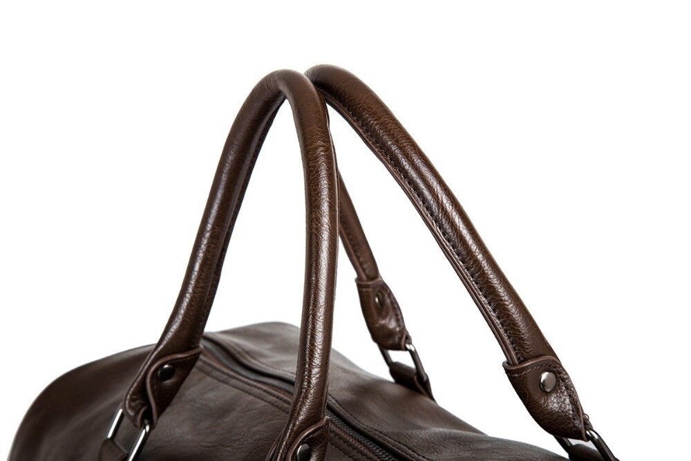 Black PU leather travel bag with strong zippers, durable and spacious carry-on.