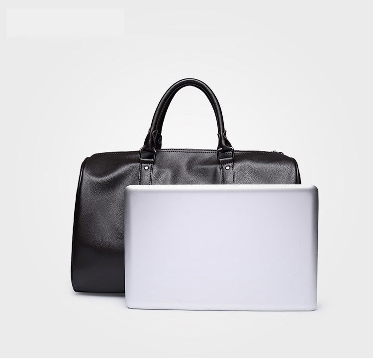 Durable black PU leather duffel bag, ideal carry-on for weekend trips.
