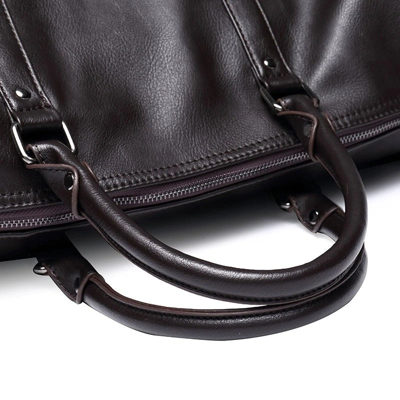 Black PU leather travel duffel, a durable carry-on weekender for men & women.
