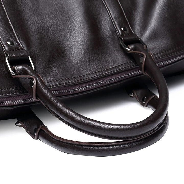 Black PU leather travel duffel, a durable carry-on weekender for men & women.