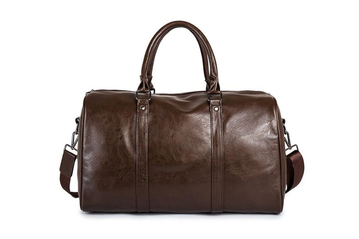 Modern brown PU leather luggage, large unisex travel duffel with strong straps.