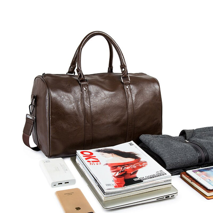 Unisex brown PU leather duffel bag, spacious weekender luggage for travel.