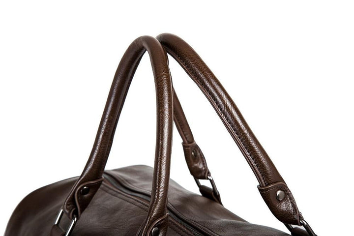 Sleek black PU leather carry-on bag, durable and large for travel.